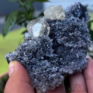 Optical clarity calcite crystal specimen with Flowering Quartz